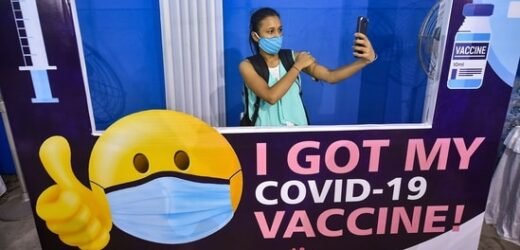 As Delta variant cases rise, WHO asks fully vaccinated to keep masks on