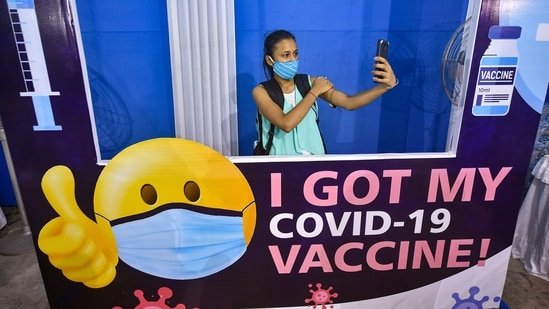 As Delta variant cases rise, WHO asks fully vaccinated to keep masks on